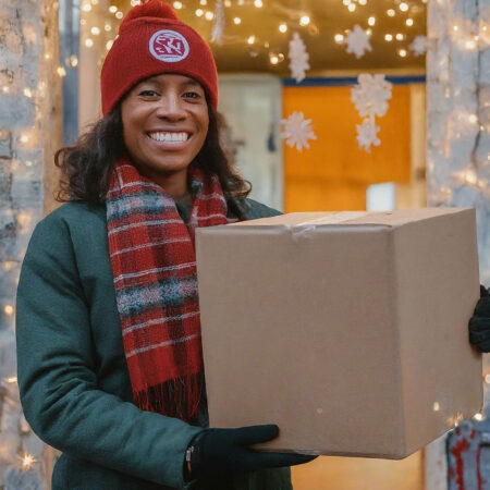 African American holding a box of gifts
